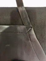 Premium black neck strap apron for cooking and grilling. Stylish and durable accessory.