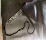 Black premium apron with a comfortable waist strap for chefs and cooking enthusiasts.