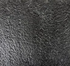 Antique brushed granite with a leathered finish in a diamond pattern.